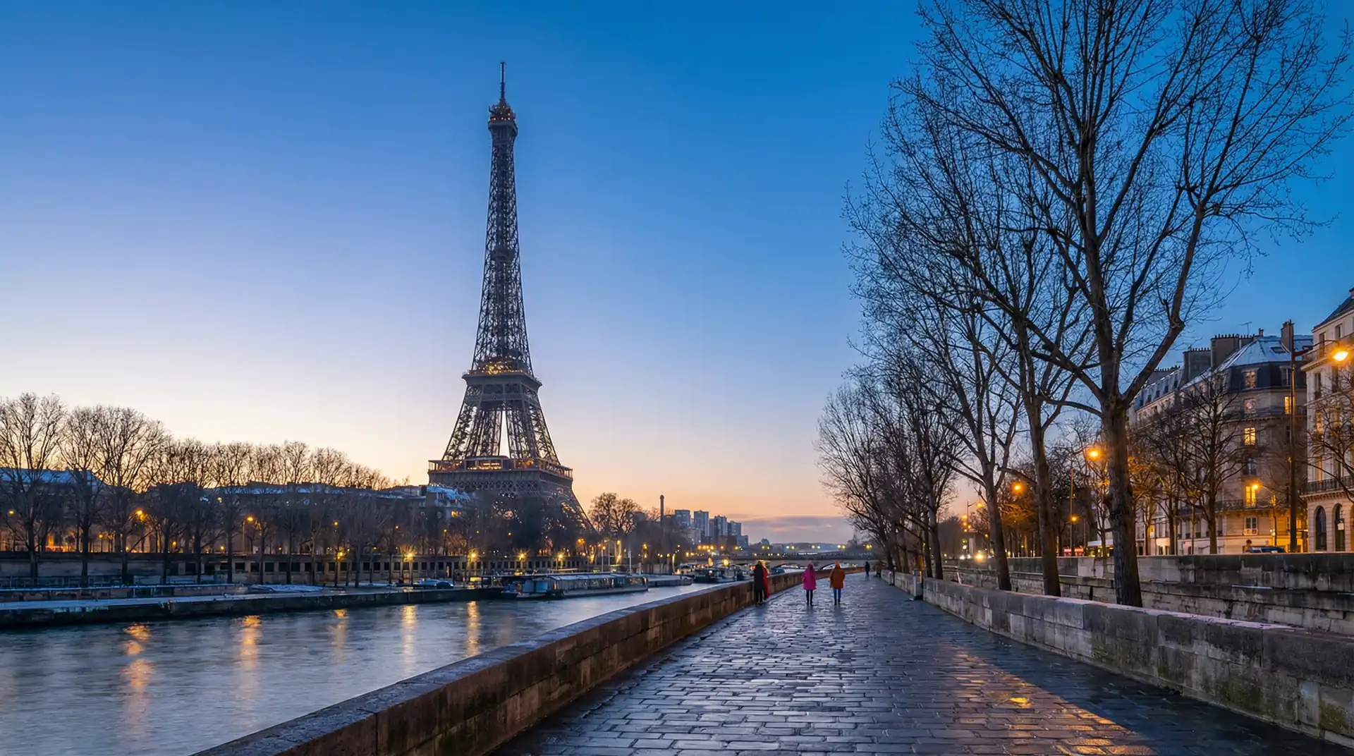 Eiffel Tower illuminated at night with Paris cityscape — OraVisa France visa services from Dubai