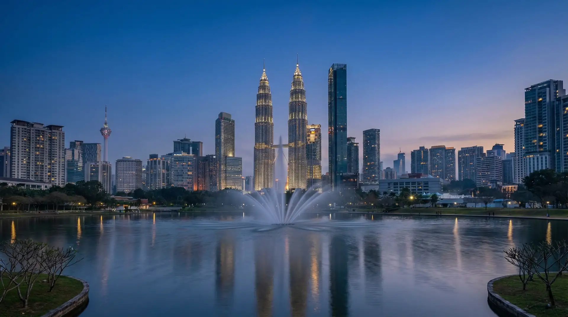Petronas Twin Towers illuminated at night in Kuala Lumpur, Malaysia — OraVisa Malaysia visa services from Dubai