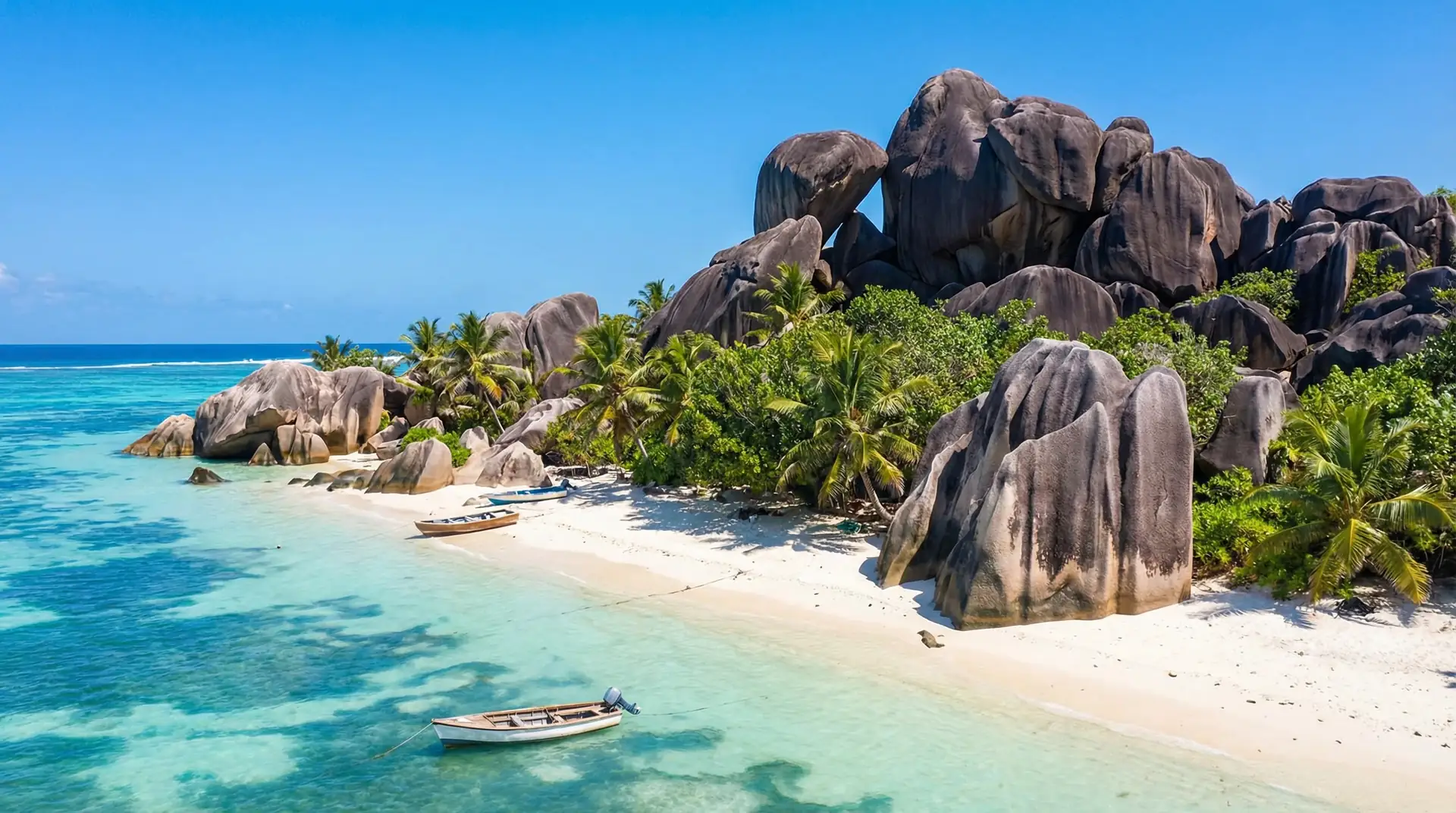 Pristine Seychelles beach with iconic granite boulders and turquoise Indian Ocean waters — OraVisa Seychelles visa services from Dubai