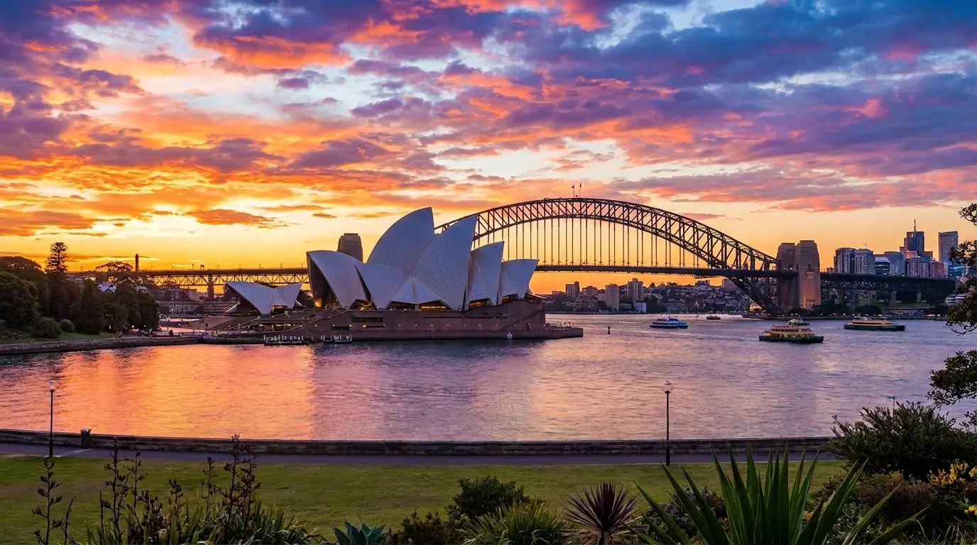 An Australian passport-style travel document beside the Sydney skyline and harbour, illustrating that from 1 July 2026 Australia raised its visa application charges by about 25% — the Visitor visa (subclass 600) Tourist stream now costs from AUD 250 when applied for from outside Australia.